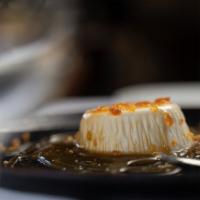 Panna Cotta  · Delicate Crema Chilled and Served with Coconut Pineapple and Coconut Flakes Toasted