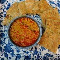Roti Telur  · Indian pancake with egg, onion, pepper, chili and curry dipping sauce