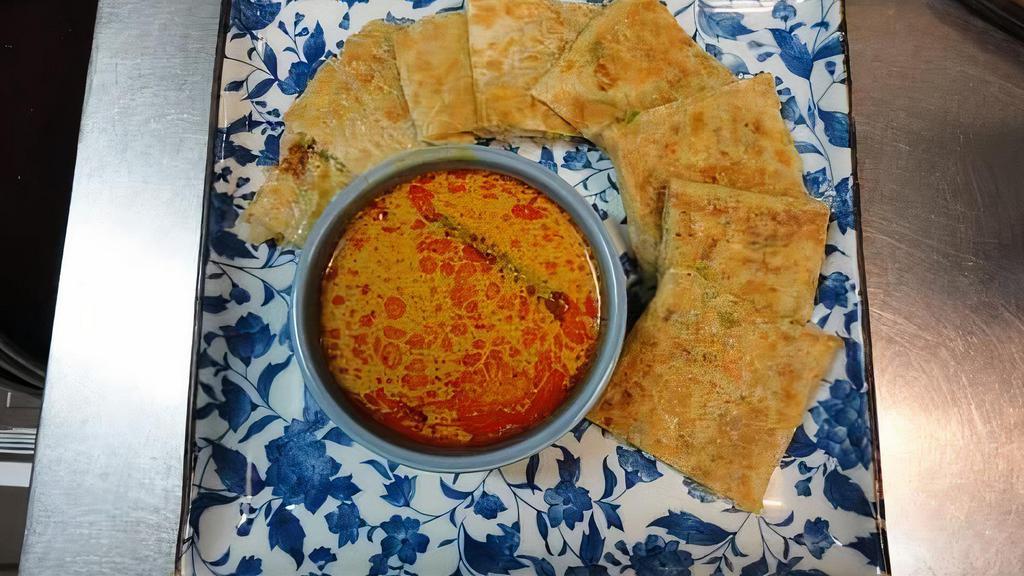 Martabak · Roti with Ground beef, chilli, pepper, and egg. comes with curry dipping sauce