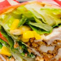 Spicy Wrap · Spicy. Original or grilled chicken tenders, romaine lettuce, jalapeños, tortilla strips, cor...