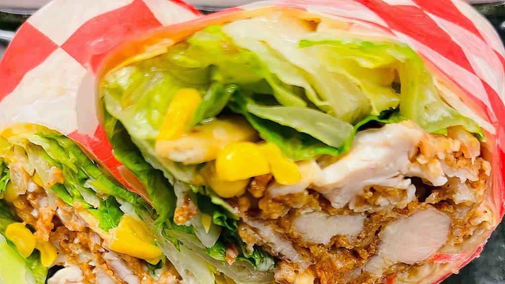Spicy Wrap · Spicy. Original or grilled chicken tenders, romaine lettuce, jalapeños, tortilla strips, corm, tomatoes, spicy dressing, and Cheddar Jack cheese. All wrapped inside a 12