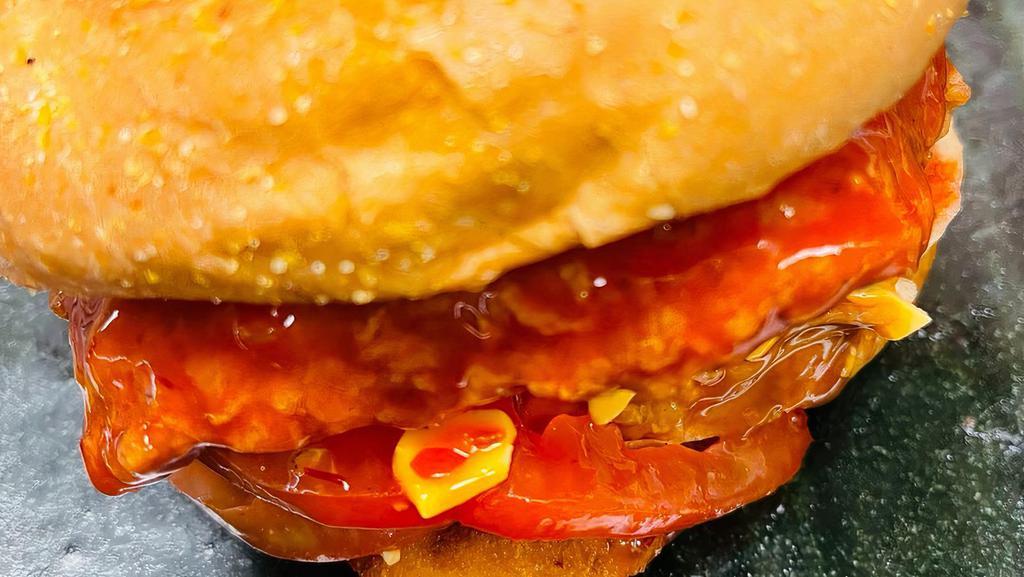 Buffalo Chicken Sandwich · Your choice of either original or grilled chicken tender placed in between a warm kaiser roll bun top leaf lettuce, tomatoes, American cheese, ranch dressing on the sandwich bun, dip chicken tender in buffalo sauce.