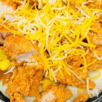 Mashed Potato Bowl · Mashed potatoes covered with brown gravy, Cheddar Jack cheese, corn and chopped chicken on t...