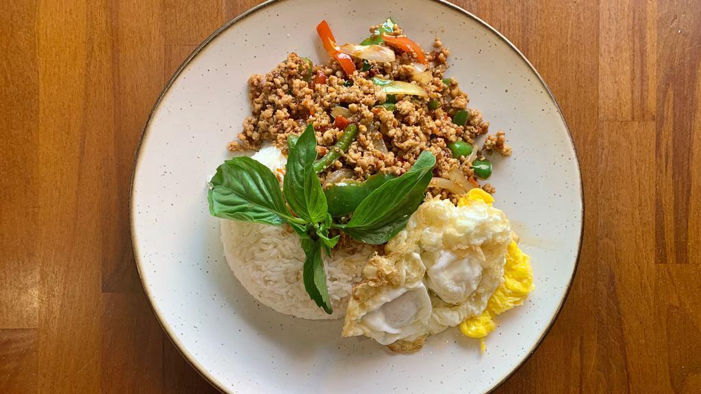 Minced Chicken Basil · Sauteed minced chicken in a spicy basil sauce with onions and bell peppers. Served over the jasmine rice and top with fried egg.