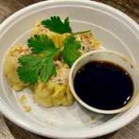 Thai Steamed Dumplings · Grounded chicken and shrimp, water chestnuts and shiitake mushrooms, served with sweet soy-v...