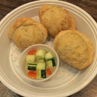 Curry Puffs · Crispy fried Puff pastry stuffed with minced chicken, potatoes, onions and curry powder, ser...
