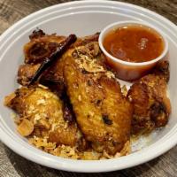 Thai-Herbed Wings · Fried marinated chicken wings topped with crispy Thai-herbs served with sweet chili sauce.