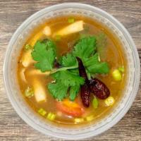 Tom Yum · Lemongrass-shrimp broth with white mushrooms, tomatoes, scallions and cilantro. Spicy. Glute...