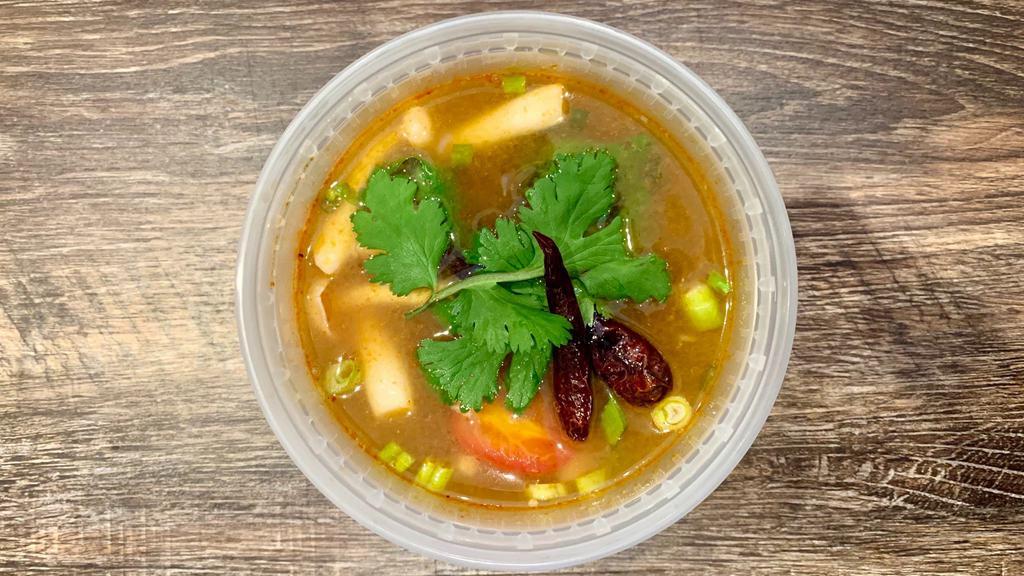 Tom Yum · Lemongrass-shrimp broth with white mushrooms, tomatoes, scallions and cilantro. Spicy. Gluten free.