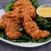 Chicken Tenders With French Fries · Delicious chicken tenders with French Fries.
