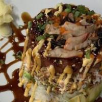 Tuna Tower · Over rice, spicy tuna, crab salad, avocado, squid salad, masago, scallion, spicy sauce, teri...