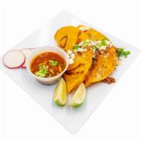 Birria Taco · Corn tortillas dipped in consome filled with queso derretido Oxaca, birria, onion and cilant...