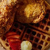 Chicken & Waffles · Boneless Fried Chicken Thighs served on a Brown Butter Waffle with Maple Syrup and Blueberry...