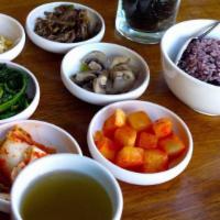 Rice And Banchan · Assortment of traditional Korean side dishes made in-house, served with crispy seaweed. Your...