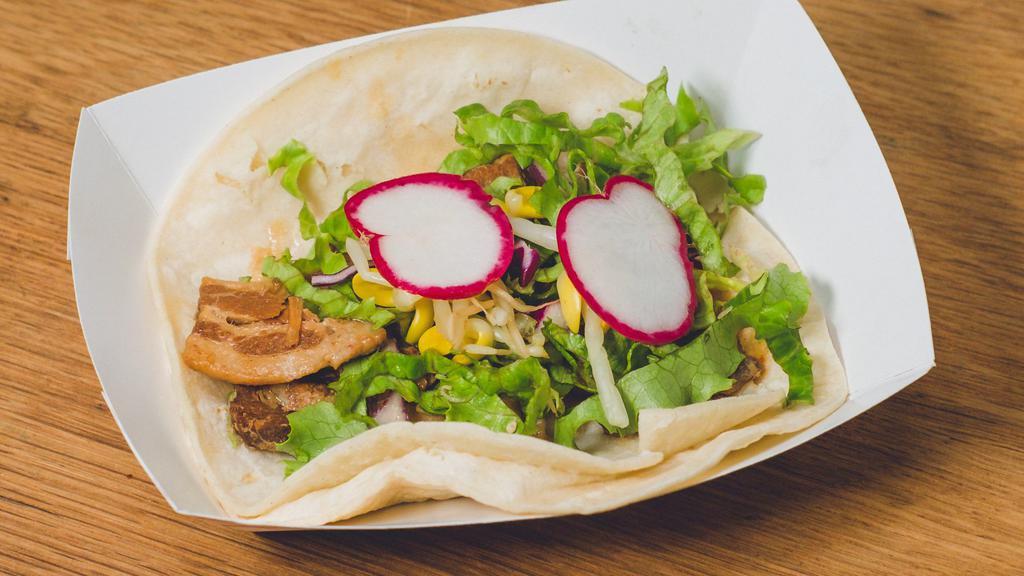 Pork Belly Taco · Soy-braised Berkshire pork belly, served on corn tortillas with bean sprouts, red leaf lettuce, soy dressing, and radish *Cannot be made gluten free