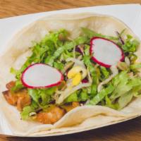Spicy Pork Taco · Berkshire pork shoulder sautéed with our spicy house-made Korean BBQ sauce, served on corn t...