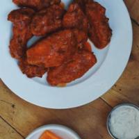 Very Spicy Buffalo Wings · A classic favorite thats on FIRE! Served with housemade bleu cheese dressing, pickled white ...