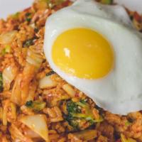 Kimchee Bokkeum Bap · Stir-fried kimchee, vegetables, and rice. Add fried egg, pork, chicken, tofu for an addition...