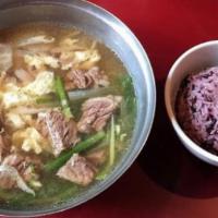 Kalbitang 갈비탕 · Tender beef short rib soup with onions, egg, oyster mushroom, sliced mu radish, scallions an...