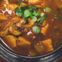 Vegan Denjang Chigae 채식주의자 된장찌개 · Spicy and pungent bean-paste stew with tofu, Korean pepper, zucchini, mushroom, onion, potat...