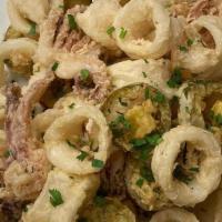 Fried Calamari · Calamari and sliced cherry peppers, lightly floured and fried, complimented with a side of s...