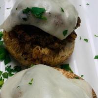 Stuffed Mushrooms · Mushroom caps stuffed with sweet sausage and melted provolone
