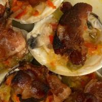 Clams Casino · Spicy baked clams topped with chopped peppers, onions, celery, and crispy bacon