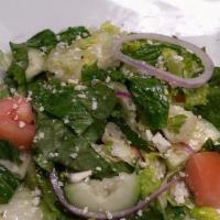 Italian House · Romaine lettuce with heirloom tomatos  and cucumbers and  tossed with Italian house dressing