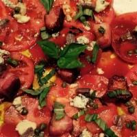 Tomato Salad · Large heirloom tomatoes topped with Nueske applewood smoked bacon, imported Italian gorgonzo...