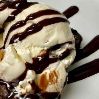 Brownie · Homemade Fudge Brownie topped with Vanilla Ice-Cream and drizzeled with Chocolate