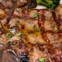 Cowboy Steak 20 Oz · 20 ounce Ribeye Steak with mushrooms and onions