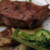 French Cut Veal Chop · 16 oz. French cut veal chop seasoned and grilled and onion drizzled with a balsamic glaze