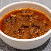 Lamb Or Goat Curry · Lamb or goat cooked in a mild spice.