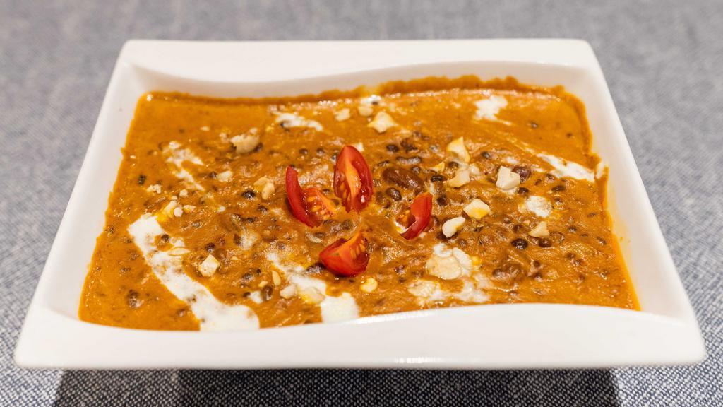 Dal Makhani · Black lentils simmered in tomatoes & onion with cream.