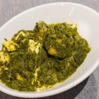 Saag Paneer · Fresh homemade cottage cheese in a spinach purée.