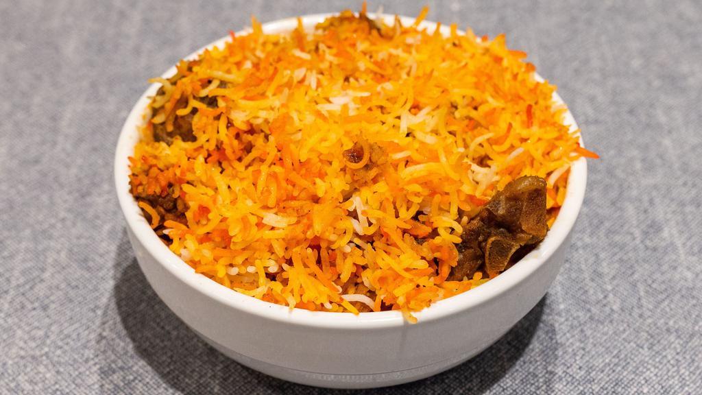 Chicken, Lamb, Or Goat Biryani · Chicken, lamb, or goat cooked with basmati rice and mild spices.