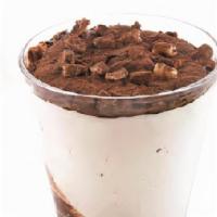 Gelato Coppa Stracciatella · Chocolate chip gelato swirled together with chocolate syrup, topped with cocoa powder and ha...