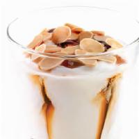 Gelato Coppa Strawberries & Caramel · Fior di latte gelato, swirled with caramel, almond crunch and wild strawberries, topped with...