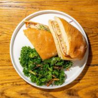 Chicken Schnitzel Sandwich · Aged white cheddar, sugar snap slaw, and honey mustard vinaigrette on a brick oven ciabatta....