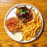 The Brooklyn Tree Burger · Grass fed beef with aged white cheddar, smoked tomato aioli, seasonal greens, and pickles. A...