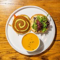 Falafel Burger · Vegan. House hummus, house pickles, seasonal greens, tahini dressing on a sweet potato bun. ...
