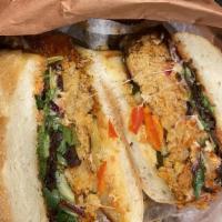 Veggie Loaf Sandwich · Garbanzo loaf. The specialty with red pepper glaze, gruyère, seasonal greens, and pickles on...