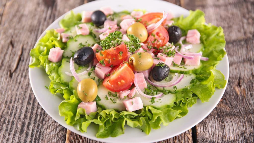 Chef'S Salad · Juicy ham, salami, creamy cheese, tomatoes, radish, olives, onions, and green peppers over a bed of lettuce.