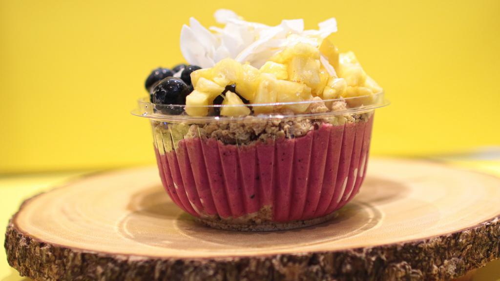 Tropical Bowl · Organic pitaya, mangoes, strawberries, banana, apple juice 

Topped with blueberries, coconut, pineapples, granola, honey