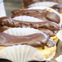 Eclair Small · Cream puff filled with custard, topped with chocolate ganache.