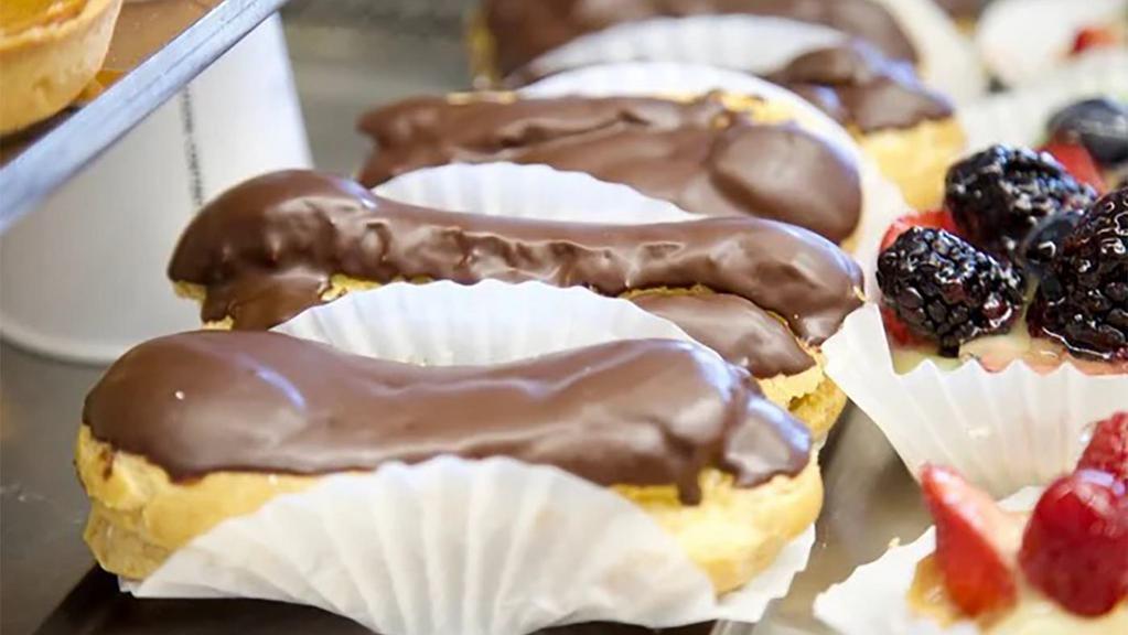 Eclair Small · Cream puff filled with custard, topped with chocolate ganache.