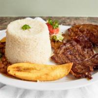Carne Asada · Grilled steak with rice, beans, plantains, and salad.