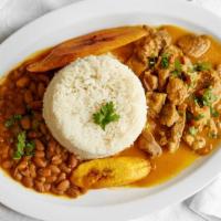 Carne Guisada · Beef stew with rice, beans, and plantains.