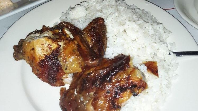 Arroz Con Pollo · Rice with chicken.