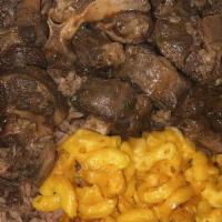 Oxtails · Includes two sides. (Mac and cheese not included in small plate).